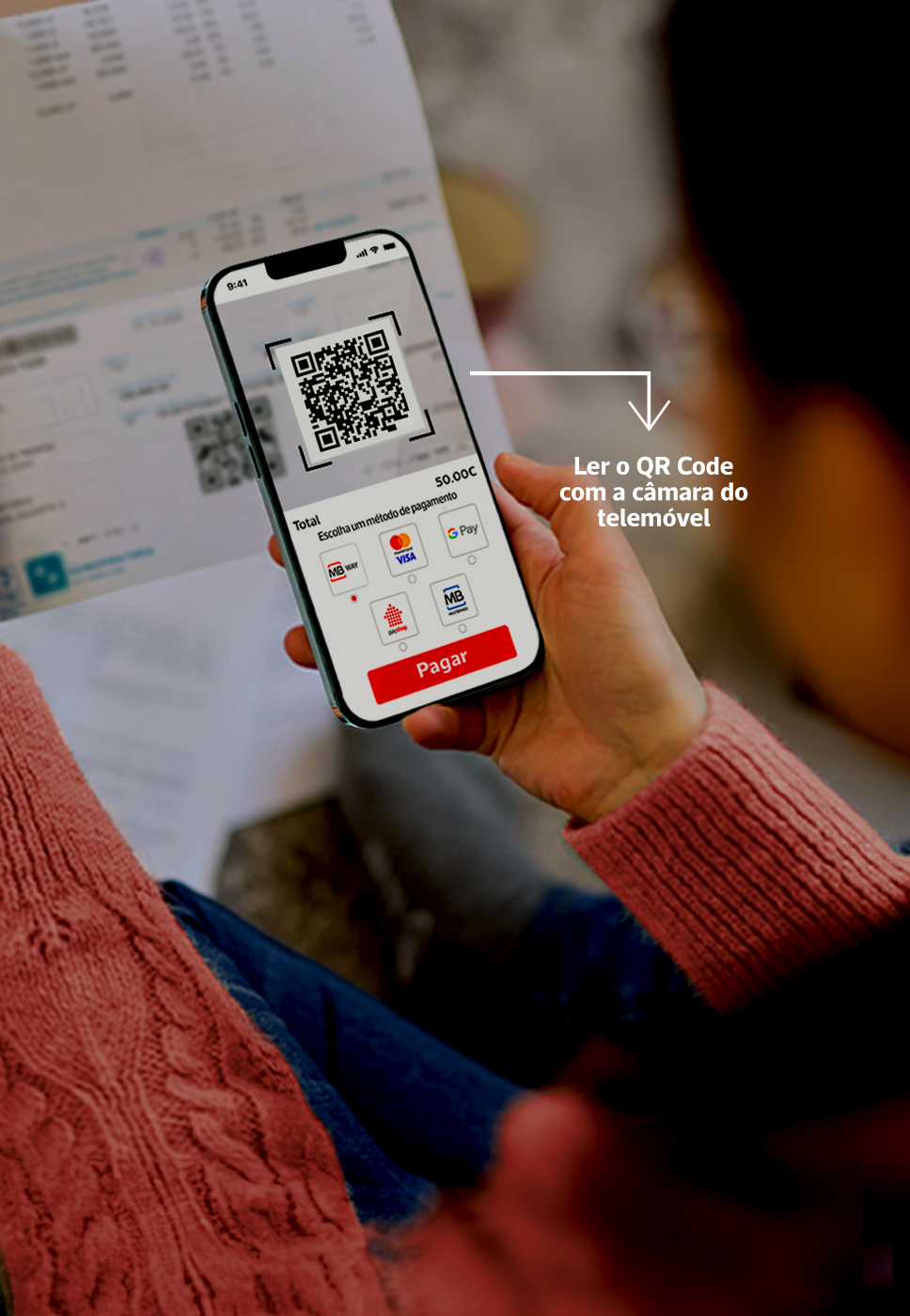 Senhora na app da POP a fazer um pagamento e onde se lê 